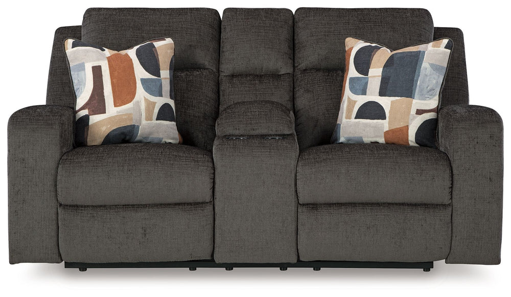 Indulgent comfort meets fashion-forward flair in this reclining loveseat with console. Its luxuriously soft upholstery and captivating color show off your cozy yet smart style. Sleek track arms infuse a modern sensibility, while the striking accent pillow