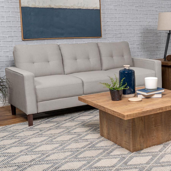  this sofa boasts a perfect small-scale design. Its classic track arm and self-welt detailing highlight the superior tailoring. The grid-tufted boxed back cushions and pocket coil spring cushion construction ensu