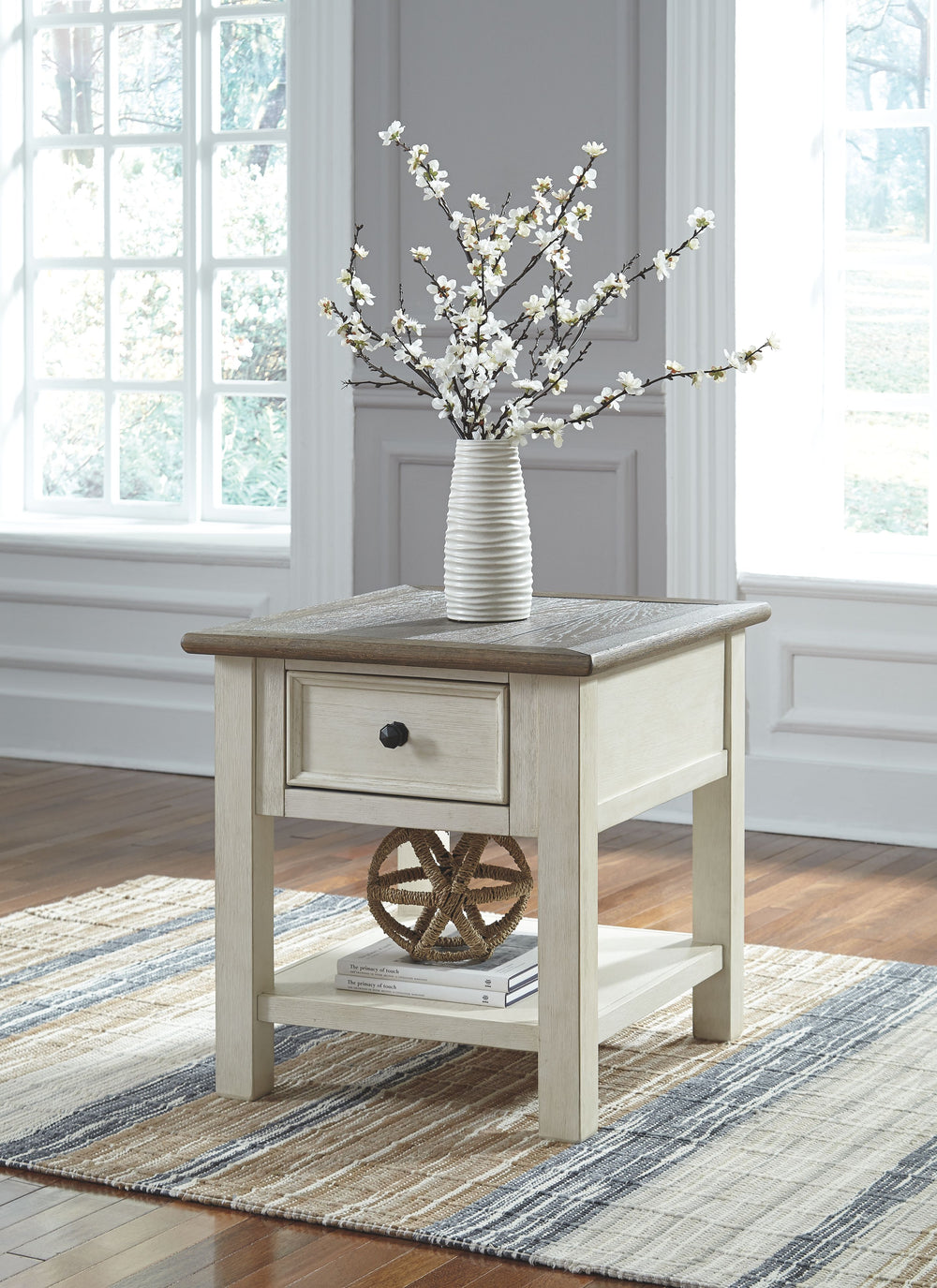 Whether your style is farmhouse fresh, shabby chic or country cottage, youâ€™ll find this end table dressed to impress. Its two-tone, gently distressed finish pairs weathered oak with antique white for that much more quaint character. Charming elements in
