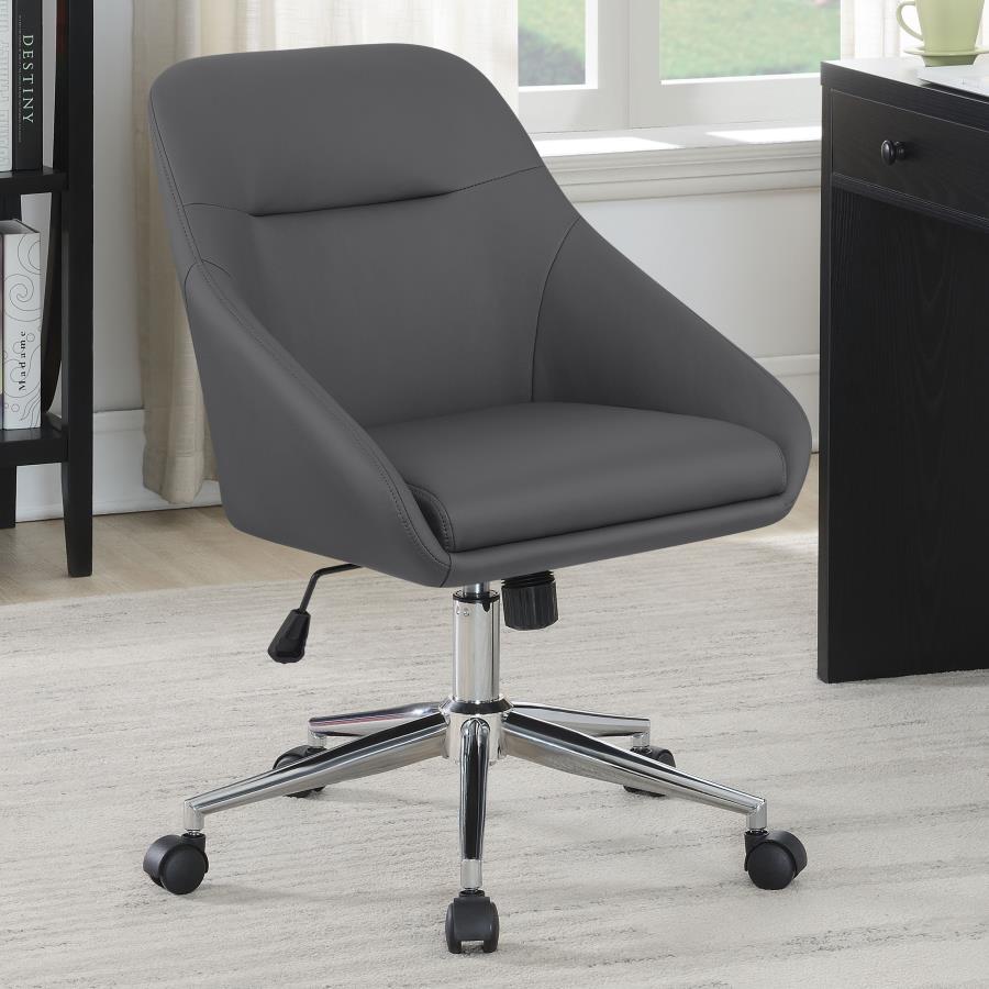 Wrapped in soft and smooth leatherette, this modern office chair features contoured edges for an elegant, contemporary silhouette. Lean against the supportive, comfortable backrest as you focus on work and other tasks. The seating also features a pintuck 