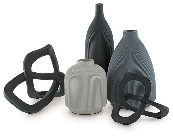 Give your space a contemporary vibe and lots of variety with this accessory set. These vases and sculptures, with a medley of neutral hues that work in beautiful harmony, mix well with your existing decor. Displayed in a group or individually, their uniqu