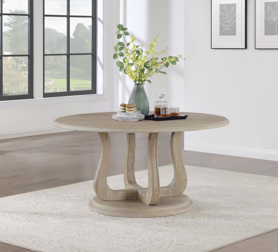 Design your inviting dining space around this modern farmhouse round dining table. Its welcoming ambiance is encouraged with its silhouette, creating a perfect spot for family dinners and easy-going conversation. The table features a decorative base with 