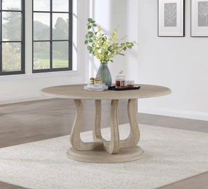  creating a perfect spot for family dinners and easy-going conversation. The table features a decorative base with 