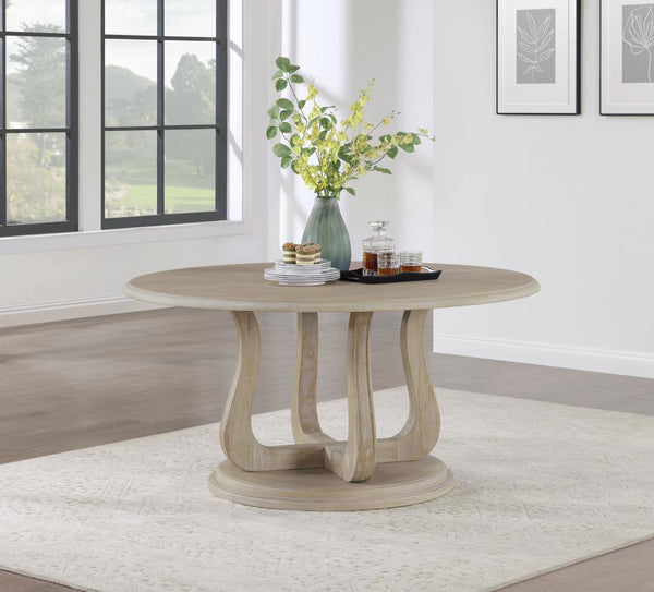  creating a perfect spot for family dinners and easy-going conversation. The table features a decorative base with 