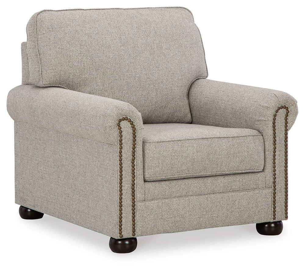 Inspired by the past but rooted firmly in the present, this chair complements your transitional seating area. Its versatile upholstery is delightfully detailed for a subtle herringbone effect. Designer touches like decorative nailhead trim and bun legs ad