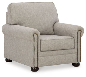 Inspired by the past but rooted firmly in the present, this chair complements your transitional seating area. Its versatile upholstery is delightfully detailed for a subtle herringbone effect. Designer touches like decorative nailhead trim and bun legs ad