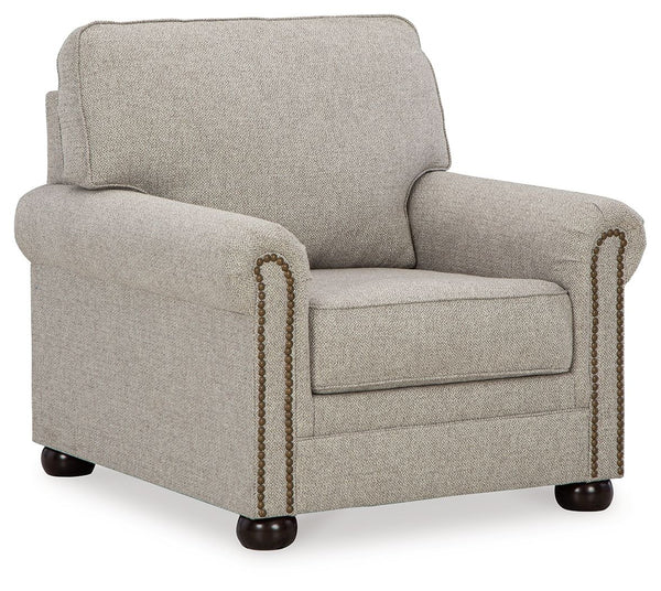 Inspired by the past but rooted firmly in the present, this chair complements your transitional seating area. Its versatile upholstery is delightfully detailed for a subtle herringbone effect. Designer touches like decorative nailhead trim and bun legs ad