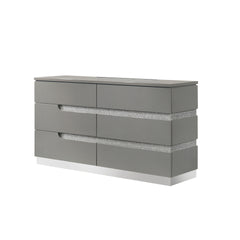 The Paradox Six Drawer Dresser in Gray combines contemporary appeal with robust functionality. Its gleaming Gray gloss laminate finish offers a sleek, modern look while providing the practical benefits of scratch and water resistance. Crafted from a combi