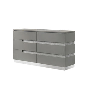 The Paradox Six Drawer Dresser in Gray combines contemporary appeal with robust functionality. Its gleaming Gray gloss laminate finish offers a sleek, modern look while providing the practical benefits of scratch and water resistance. Crafted from a combi