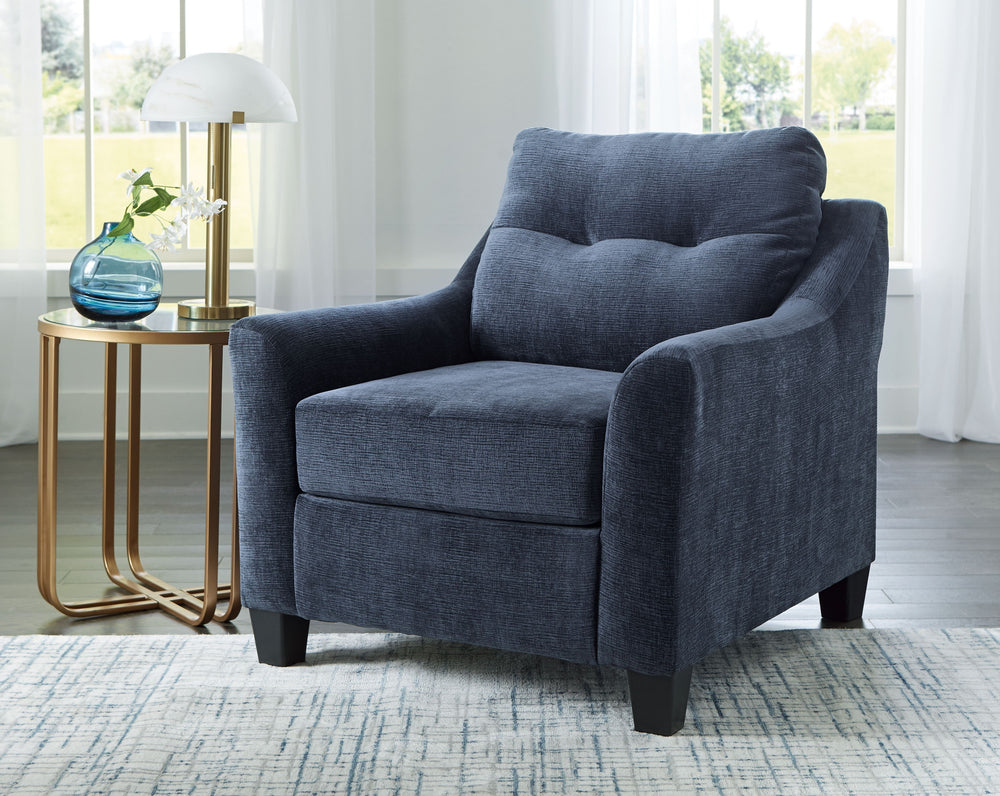 Urban contemporary meets mid century (with a pop of trend-right color) in this seating package. Supremely soft upholstery, teeming with luster and movement, finesses the set with just the right touch. Gently flared arms and tufted back cushions let you ba