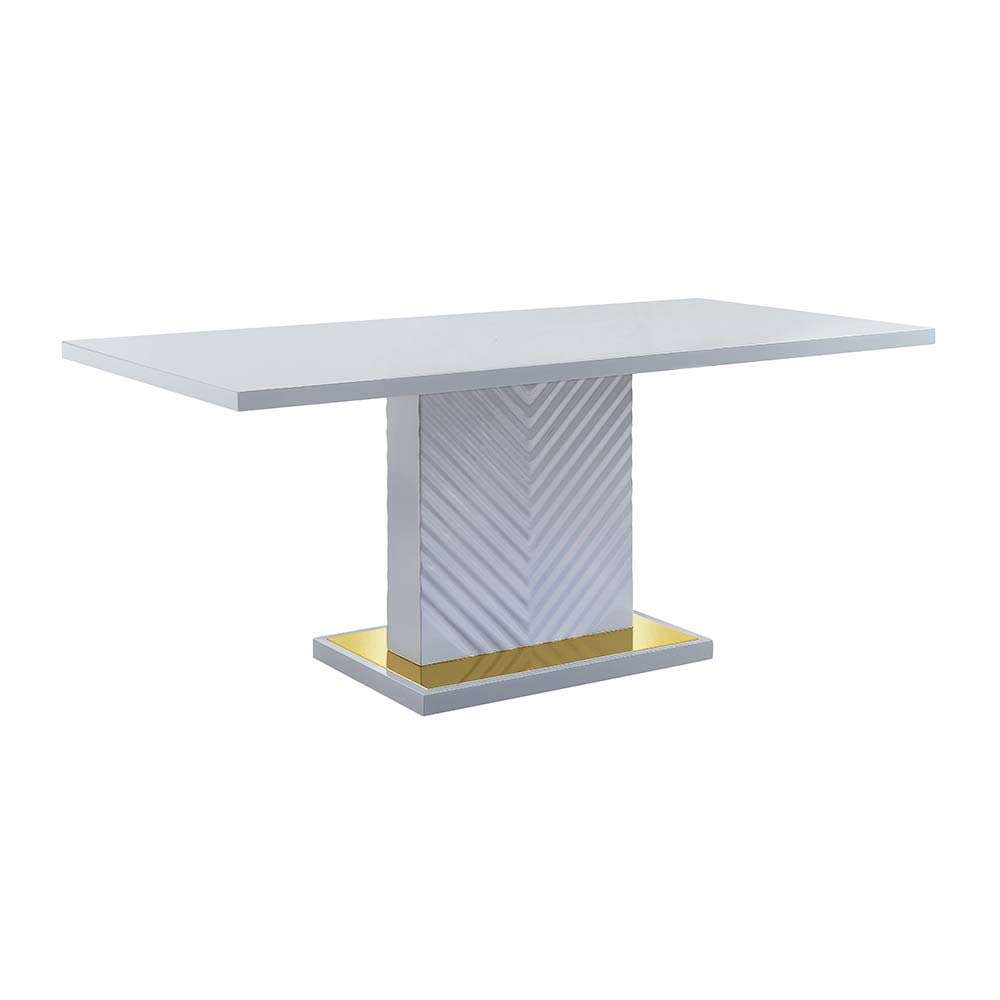 The sleek clean-lined table Gaines dining table offers subtle a hint of glam, the base offers a touch of gold to enhance the textured vertical lined pedestal. The gray high gloss finish reflects light and makes any dining space appear larger and grander. 