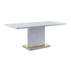 The sleek clean-lined table Gaines dining table offers subtle a hint of glam, the base offers a touch of gold to enhance the textured vertical lined pedestal. The gray high gloss finish reflects light and makes any dining space appear larger and grander. 