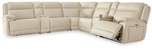 This power reclining sectional with consoles is the perfect combination of sleek style and thoughtful functionality. Engineered for comfort and convenience, it offers concealed storage compartments and endless relaxation. From movie nights to family gathe