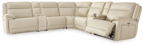 This power reclining sectional with consoles is the perfect combination of sleek style and thoughtful functionality. Engineered for comfort and convenience, it offers concealed storage compartments and endless relaxation. From movie nights to family gathe