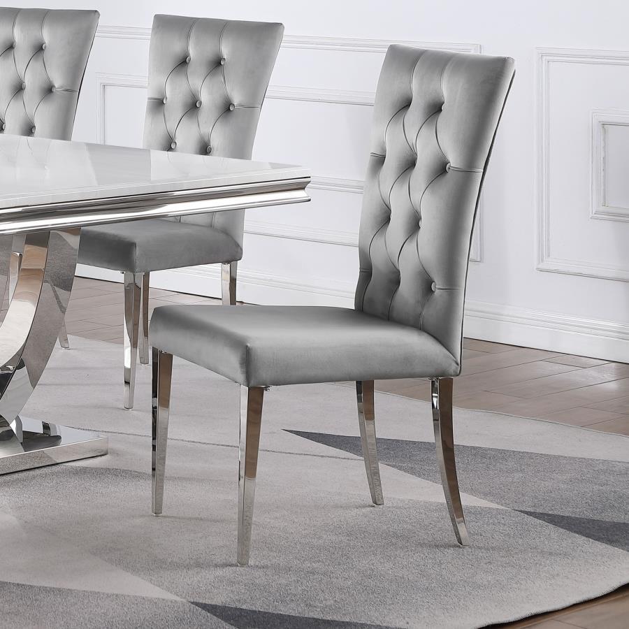 Transform your dining area into a chic space with this elegant, modern glam side chair set. Designed in a classic Parson style silhouette, these two chairs boast a tall curved back for extra comfort and support throughout long dinners. Upholstered in a pl
