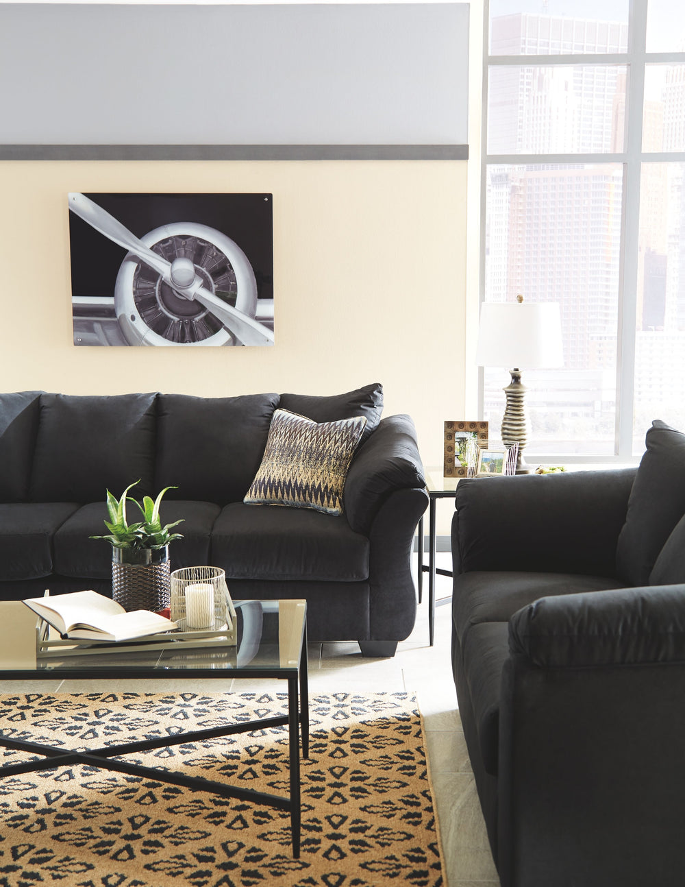 Everyone can have the best seat in the house with this sofa and loveseat. An indulgent choice with deep seats crafted for cloud-like softness, this set is the ideal merger of modern flair and classic staying power. <h4><b>Darcy - Black - Sofa</b></h4> <ta