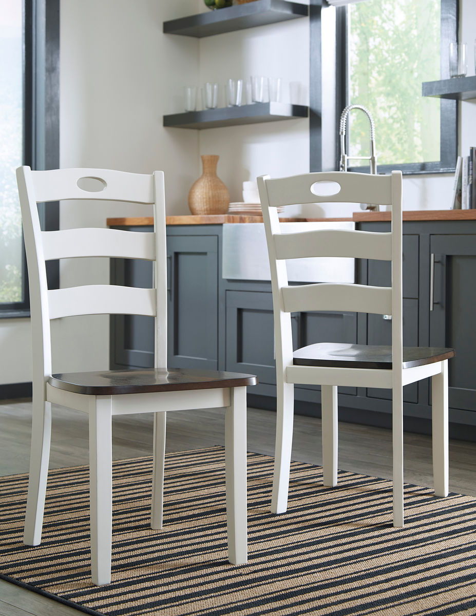 Made with Birch veneers and select hardwood solids in a distinctive two-tone cottage finish. Cream table base and chair frame with medium brown color table tops and chair seats. Updated cottage styling, table has arched aprons and chair has pierced ladder
