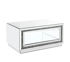 Make a striking statement in your home with this Noralie Coffee Table. Featuring mirror finish with faux diamond inlay, it creates a bold, yet elegant textured look. Shimmering border design with faux diamonds adds modern glamour to this piece. The bottom