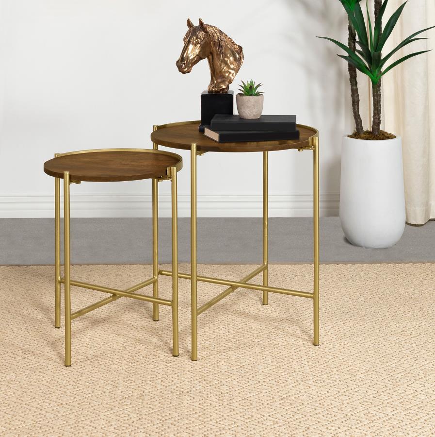 Soft gold adds an element of warmth to a two-piece set of modern nesting tables. Charming in a compact living space, the smaller table tucks under the larger to create a waterfall effect that-'s sure to catch the eye. Each table boasts a perfectly round t