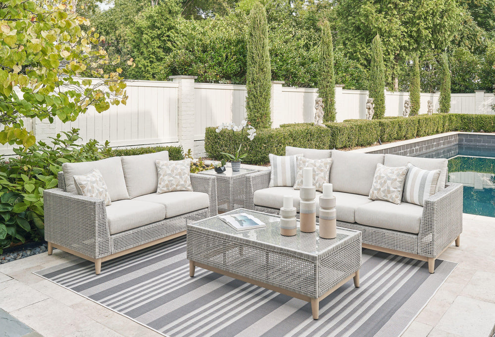 This set is a beautiful addition to any outdoor living space. Resin wicker on an aluminum frame. Wood look paint finish. Nuvella premium high performance fabric. Tempered glass top tables. Stainless steel hardware. <h4><b>Seton Creek - Gray - Sofa with Cu