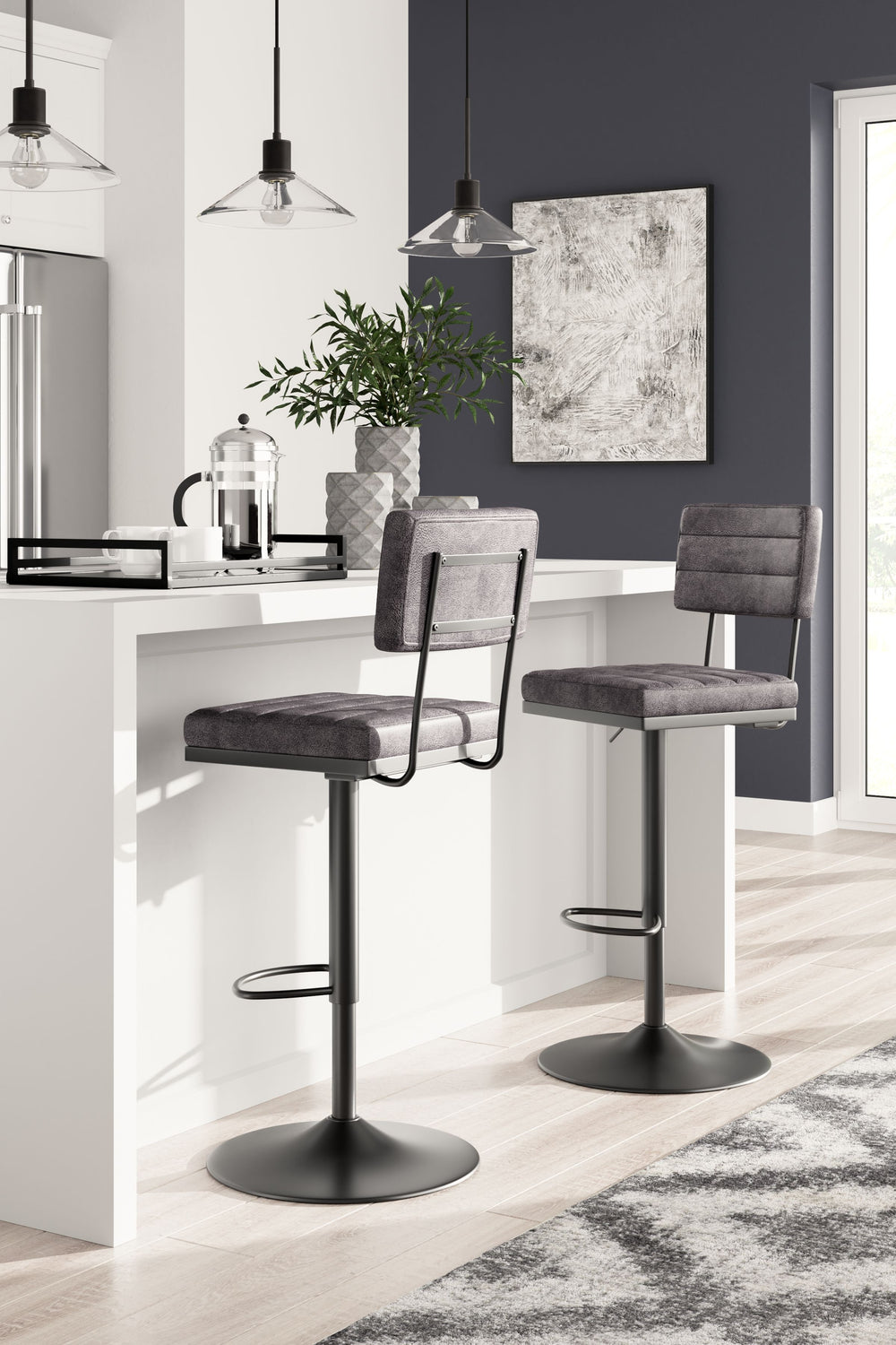 Have a seat in sleek style with this upholstered swivel bar stool. Contemporary with a casual vibe, it-'s dressed to impress with a metal frame and a cushioned seat and back wrapped in gray faux leather. Along with the bar stool-'s smooth-gliding swivel, 