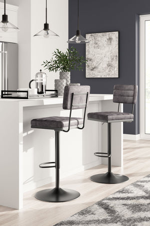  it-'s dressed to impress with a metal frame and a cushioned seat and back wrapped in gray faux leather. Along with the bar stool-'s smooth-gliding swivel