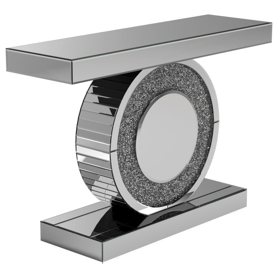 Add dazzling flair to your entryway or living room with this glamorous console table. Featuring a mirrored surface and a bold geometric design, it showcases a sculptural circular base encrusted with glittering silver crystals. The sleek rectangular top an