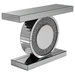 Add dazzling flair to your entryway or living room with this glamorous console table. Featuring a mirrored surface and a bold geometric design, it showcases a sculptural circular base encrusted with glittering silver crystals. The sleek rectangular top an