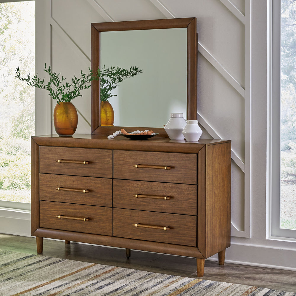 This dresser with mirror is perfect for contemporary or mid-century interiors. Its wood-tone finish is versatile and timeless. The drawers, designed with exquisite framing and elongated wooden pulls, enhance the overall aesthetic. Whether you want to refr