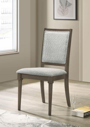  blending intricate detailing with luxurious comfort. The chair features a molded geometric design on the backrest