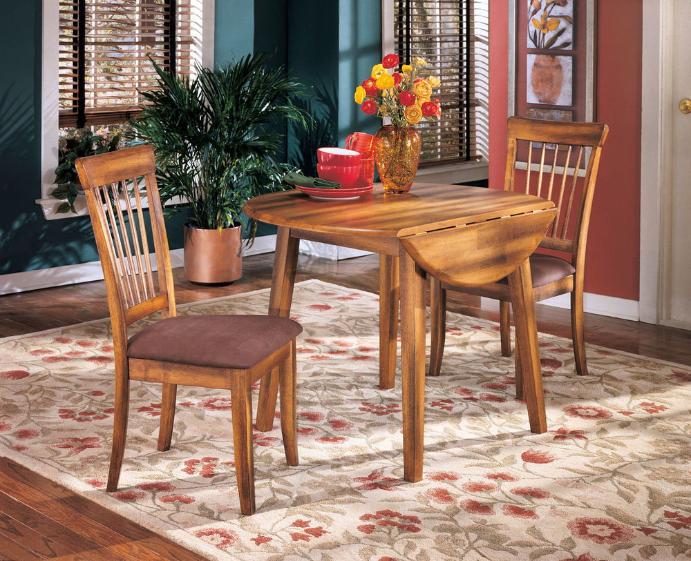 Made with select veneers and hardwood solids. Rustic hand applied finish. Round dining table (-15) features two drop leaves. RTA side chair features microfiber upholstery. Antique finished hardware. <h4><b>Berringer - Rustic Brown - Round DRM Drop Leaf Ta