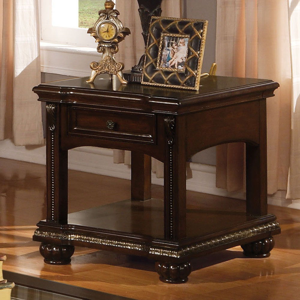 The Anondale End table is finished in brown cherry. Featuring Storage Drawers combined with modern style found in clear glass insert top and casualness found in storage drawers. The turned legs and reeded bun footing complete the timeless classic look.<br
