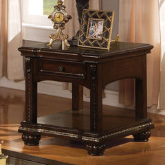 The Anondale End table is finished in brown cherry. Featuring Storage Drawers combined with modern style found in clear glass insert top and casualness found in storage drawers. The turned legs and reeded bun footing complete the timeless classic look.<br