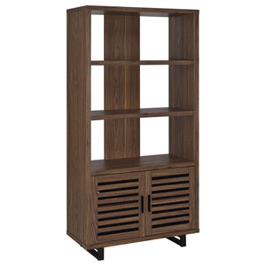 Create storage and add charm in one with a modern bookcase. It features a cabinet in the base, decorated with slatted doors that open to reveal shelving for easy storage. Upper shelves are open, with a center slat that creates dimension and offers structu