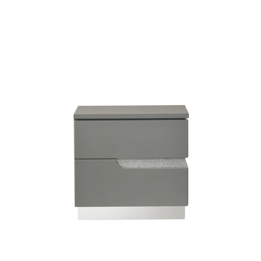 The Paradox Two Drawer Nightstand in Gray brings a blend of contemporary appeal and functional elegance to your bedroom. Featuring a gleaming Gray gloss laminate finish, this nightstand offers a sleek and modern look with the added benefits of scratch and