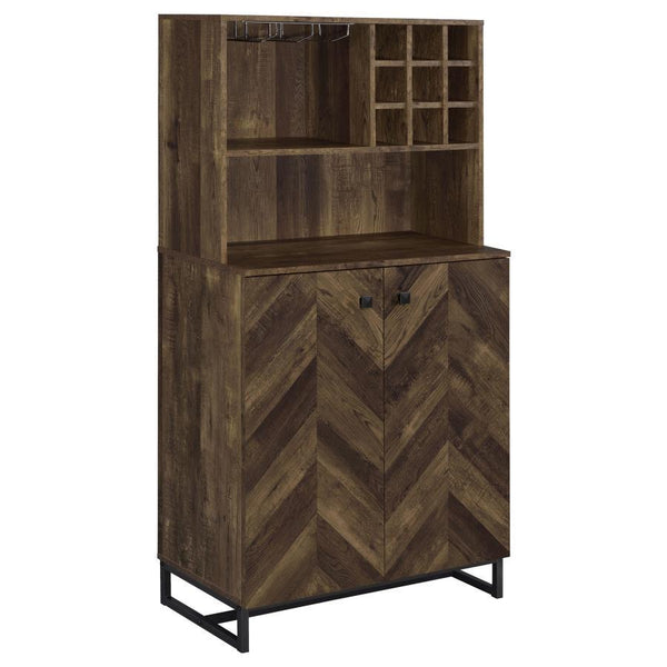 This rustic bar cabinet features a striking herringbone pattern and a warm oak finish, perfect for enhancing any living or dining space. With ample bottle and stemware storage, it offers function and flair in equal measure. The mixed material construction
