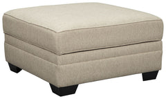 Stow in love. This ottoman with storage has you covered in more ways than one. Its ample scale makes it abundantly luxuriousâ€”leaving plenty of room for everyone to kick up their heels in style. For last-minute cleanups, what a lifesaver. Removable top u
