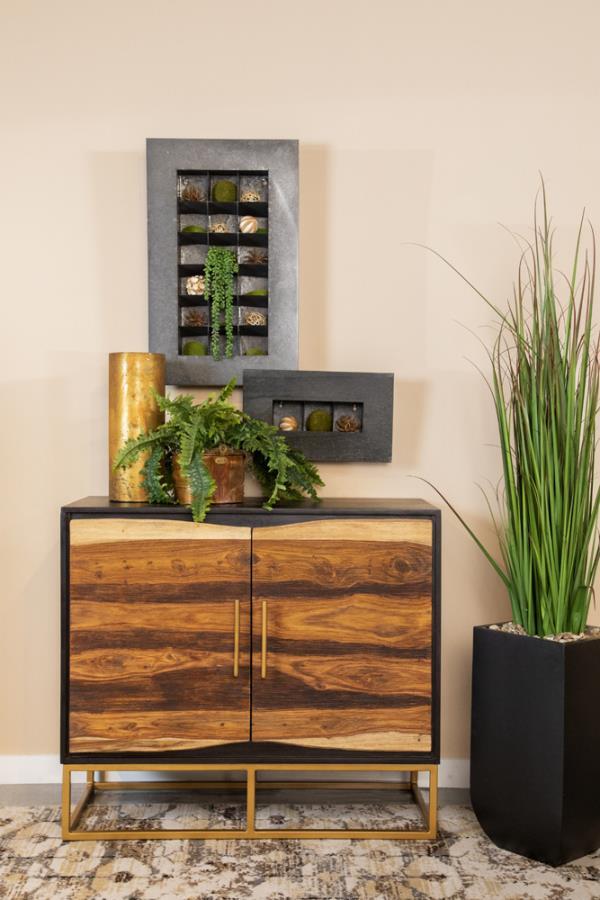 A handcrafted accent cabinet from India makes its presence known. With its mix of natural wood colors, it-'ll instantly captures attention in your living area. Gold hardware with a matching geometric base provides durability and aesthetic flair. Two large