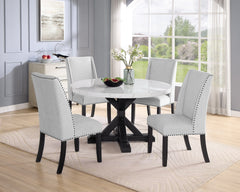 A fresh take on a traditional silhouette makes this group a great addition to your dining space. A faux marble top provides an elegant look while being easy to care for. The trestle base is updated in a contemporary charcoal finish. The upholstered dining