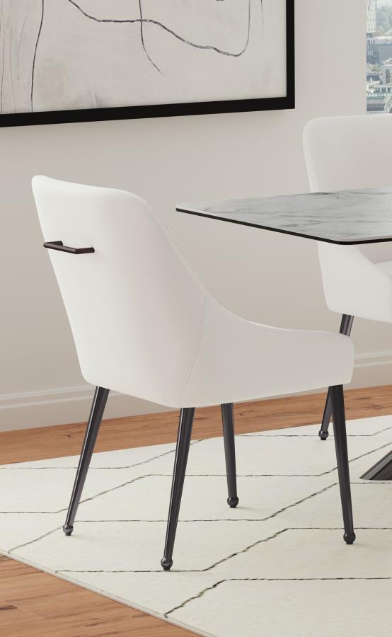 Cradle yourself in the embrace of opulence with this Italian style modern dining side chair, where comfort meets sophistication. Its plated metal legs, tapering into geometric spheres, create a foundation that-'s as sturdy as it is striking. The seat, a h