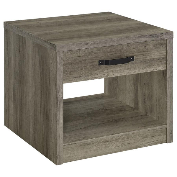 Bring rustic charm to your living room or bedroom with this versatile end table. Featuring a weathered gray finish over engineered wood and scratch-resistant veneer, it delivers a natural wood-look design. The table includes a spacious drawer with a bold 