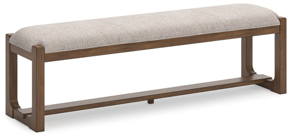 This dining bench sits comfortably at the intersection of modern lodge and farmhouse aesthetics. Your warm and welcoming disposition is reflected in its charming architectural elements and neutral textural fabric. Even with its poise, the bench remains pr
