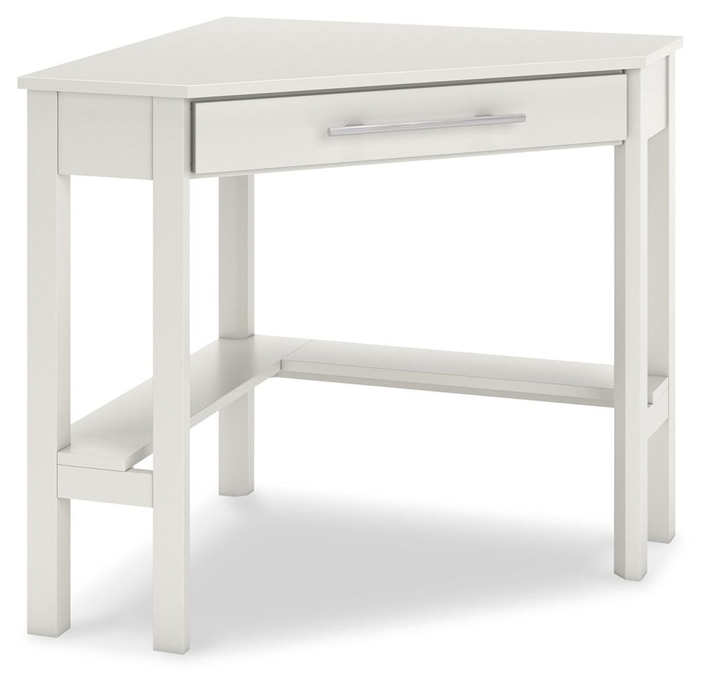 Clean-lined design takes center stage with the Otaska home office corner desk. Well-suited to small spaces, this desk leaves a small footprint as it seamlessly fits into corners. A center storage drawer keeps essentials close, while the crisp white finish