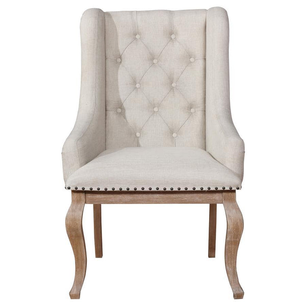  with a comfortably cushioned and smoothly upholstered seat. Rolled arms complete a comp