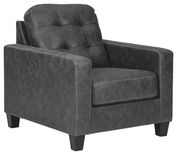This ultra-contemporary chair invites you to kick out and make yourself comfortable. Linear track arms offer a clean, sleek aesthetic, while tufted box cushions are a nod to mid-century design. Gunmetal gray faux leather offers the cool, weathered look yo