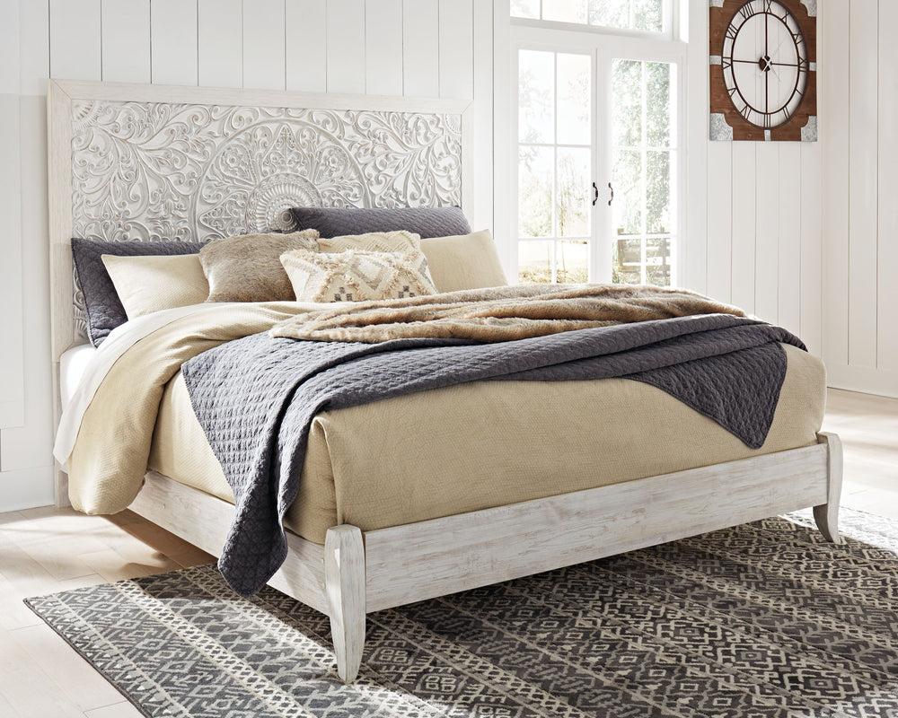 Showcase your trend-setting spirit with this bed. Inspired by bohemian tapestries, exquisite carved medallion pattern is a testament to boho-chic style. Whitewash finish sets a foundation for a room bursting with personality. <h4><b>Paxberry - Whitewash -