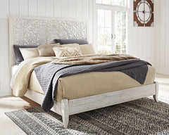 Showcase your trend-setting spirit with this bed. Inspired by bohemian tapestries, exquisite carved medallion pattern is a testament to boho-chic style. Whitewash finish sets a foundation for a room bursting with personality. <h4><b>Paxberry - Whitewash -