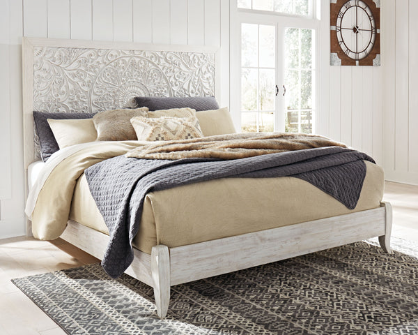 Showcase your trend-setting spirit with this bed. Inspired by bohemian tapestries, exquisite carved medallion pattern is a testament to boho-chic style. Whitewash finish sets a foundation for a room bursting with personality. <h4><b>Paxberry - Whitewash -