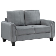 Embrace modern elegance with the refined look of a contemporary upholstered loveseat. Designed for understated character and timeless elegance, it boasts soft gray fabric with a velvety texture that encourages a cozy but sophisticated presence in your liv