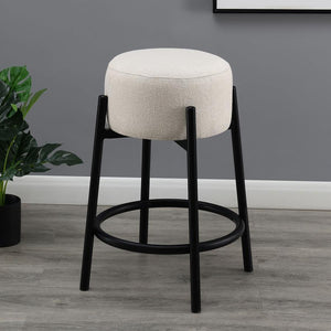  slide this pair of contemporary stools up to a bar or kitchen breakfast area. Designed with a thick pouf-like cushion wrapped in a white upholstery